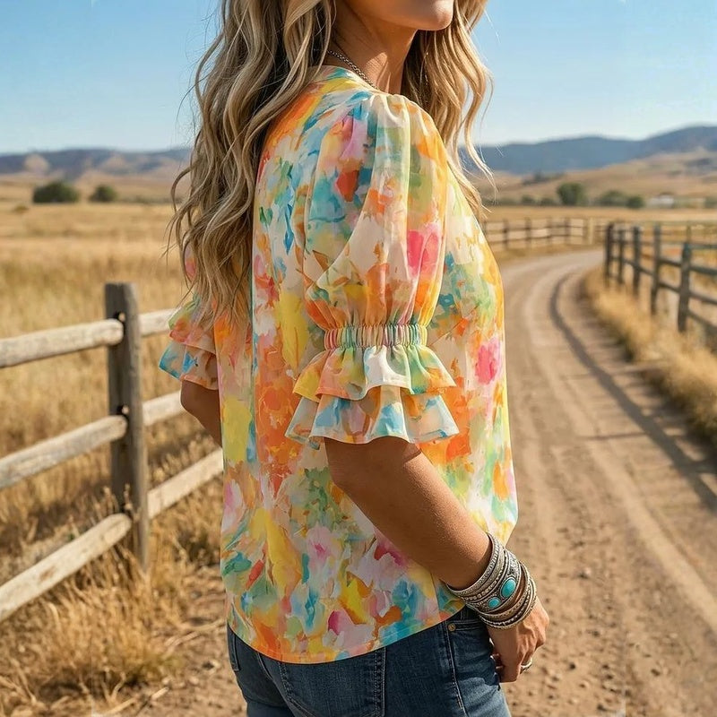 Suda – Bluse mit Blumenmuster, Knopfleiste und Puffärmeln